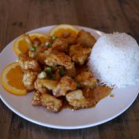 Orange Chicken · Homemade sweet and sour sauce with glazed chicken nuggets and fresh orange juice.