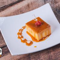 Flan · A creamy traditional style flan that glows in caramel amber melted in sweet condensed milk.
