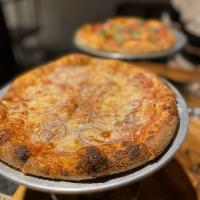 The Standard Pizza · Bianco di Napoli tomatoes, mozz, Sicilian oregano, and Grana Padano.