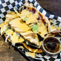 2 Tacos Dorados Gobernador · Deep fried corn tortilla, stuffed with shrimp and mozzarella cheese. Topped with shredded ca...