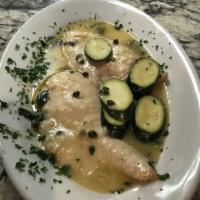 Chicken Piccata · Thin slices of chicken breast sauteed in a butter and wine sauce, zucchini and capers. Serve...