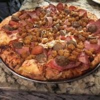 Meat Lovers Pizza · Pepperoni, sausage, Canadian bacon, salami and meatballs.