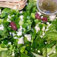 Greek Salad · Fresh Romaine, tomatoes, cucumbers and scallions with feta cheese and Greek dressing.