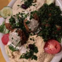 Combo Plate · A sampling of hummus, tabouleh, falafel, baba and dolma. All vegetarian.