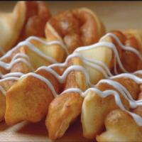 Cinnamon Twists · Rolled in a brown and white sugar cinnamon mixture and topped with a powdered sugar glaze.