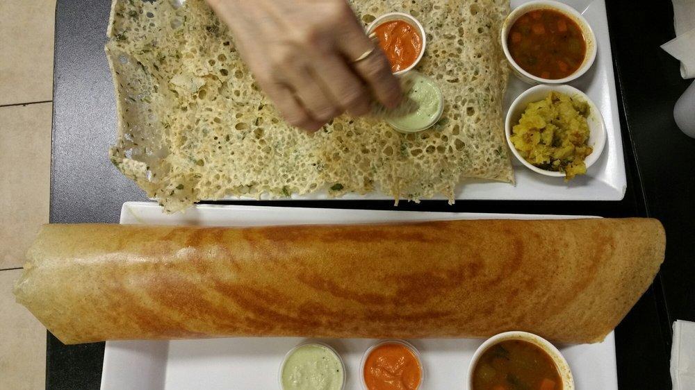 Rava Dosa · South Indian crispy crepe cooked with South Indian spices and served with sambar and chutney.