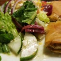Spinach Pie · Spanakopita. Flaky phyllo dough stuffed with a mixture of spinach and feta cheese. Served wi...