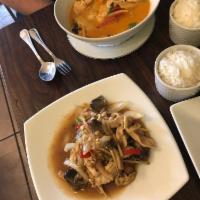 Red Curry · Served with bamboo shoot, red bell peppers, green hot peppers and basil leaves in coconut mi...