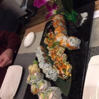 Greenwich Roll · Selected raw fish with tobiko and kani, wrapped in seaweed, light fried, topped with crunch ...