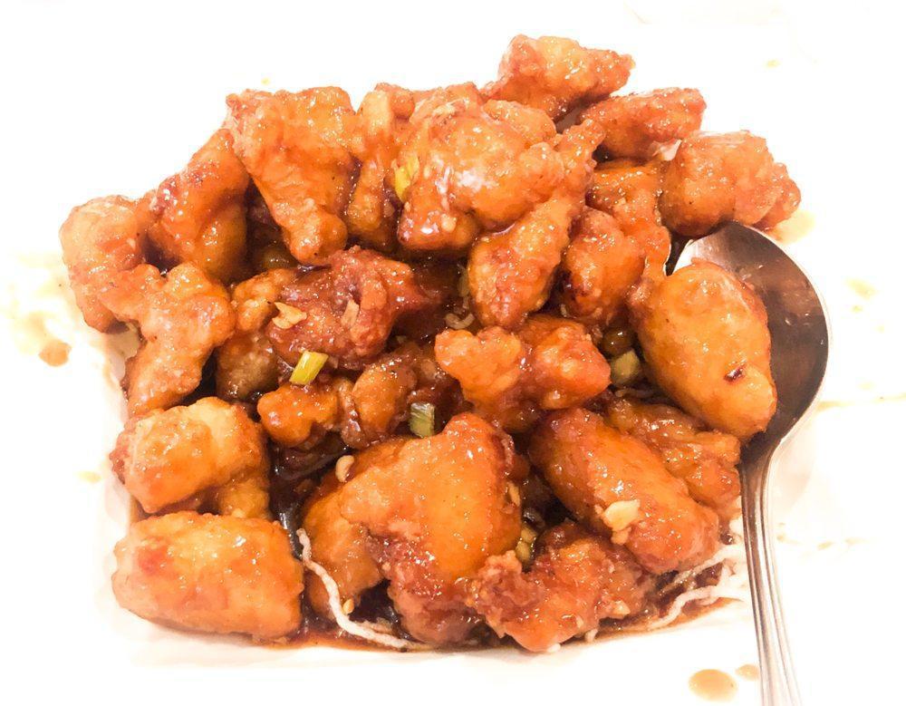Orange Chicken · Fried and garnished with broccoli. 