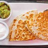 Quesadilla · A medium flour tortilla folded in half with melted cheese.