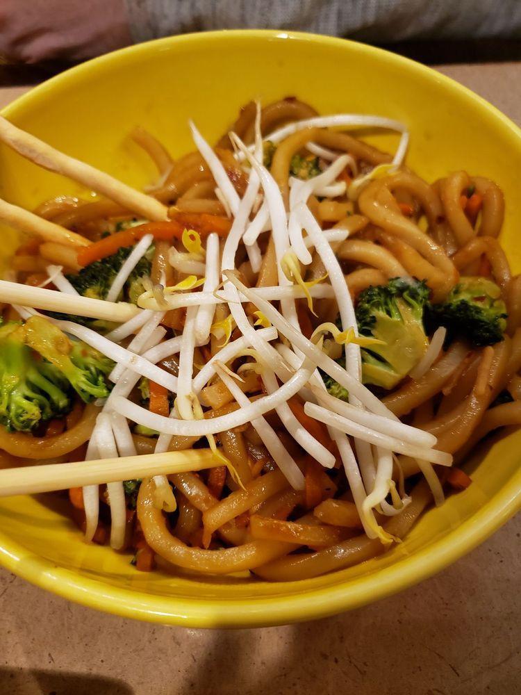 Spicy Japanese Noodles · Thick udon noodles spiked with sugar lime soy sauce and tossed with fresh broccoli, carrots and mushrooms. Topped with bean sprout and a lime wedge. Spicy.