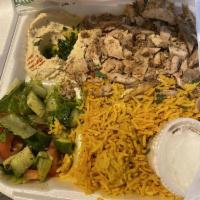 Chicken Shawarma Plate · Roasted marinated chicken served with fries or rice, garlic paste, pickles, salad and fresh ...