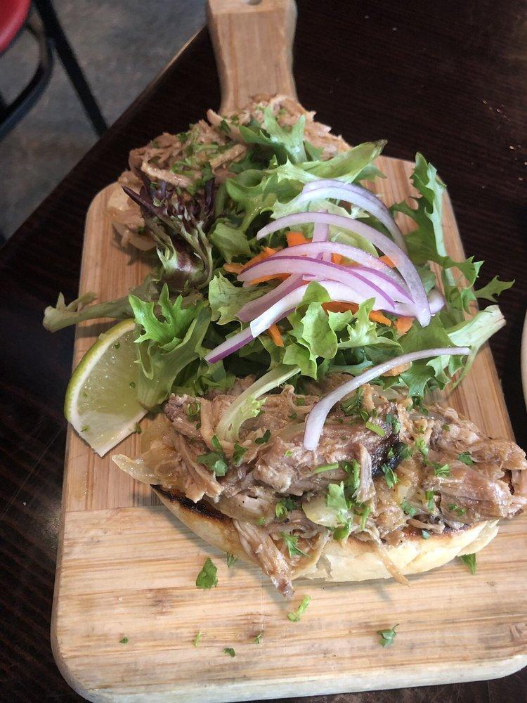 Roasted Shredded Pork Montaditos · Our famous shredded pork on toasted baguette served with olives and roasted peppers.