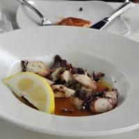 Grilled Octopus · Our grilled octopus is tender, cooked over our charcoal grill, served with oregano, olive oi...