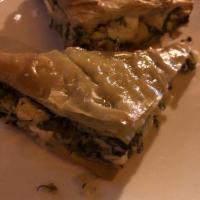 Spinach Pie · Our homemade spinach pie is made with barrel-aged feta cheese, sauteed spinach, leeks and wr...