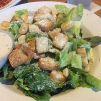 Caesar Salad · A healthy mix of romaine lettuce, croutons and Parmigiana cheese.