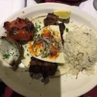 Lamb Kabob · Lightly seasoned lamb kebob grilled. Served with rice and grilled vegetables.