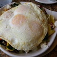 California Skillet · Fresh spinach, sundried tomatoes, artichoke hearts and goat cheese.