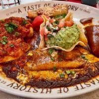 A Taste of History · Cheese enchilada, rolled beef taco, chile relleno and roasted pork tamale. Served with refri...