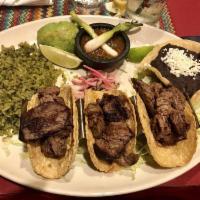 Filet Mignon Tacos · 2009. Three handmade corn tortillas with molcajete salsa and cilantro rice.