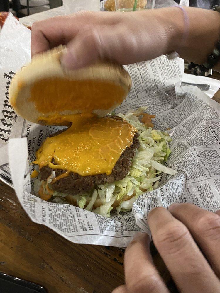 Impossible Burger · Impossible burger patty, cheese, house burger sauce, tomato, onions, pickles and lettuce.