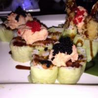New Year Roll · Spicy tuna, avocado, shrimp tempura in the color seaweed. Lobster and caviar on the top.