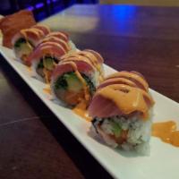 Passion Roll · Spicy tuna, salmon, yellowtail, avocado, tempura crunch, tobiko and wakame topped with tuna ...