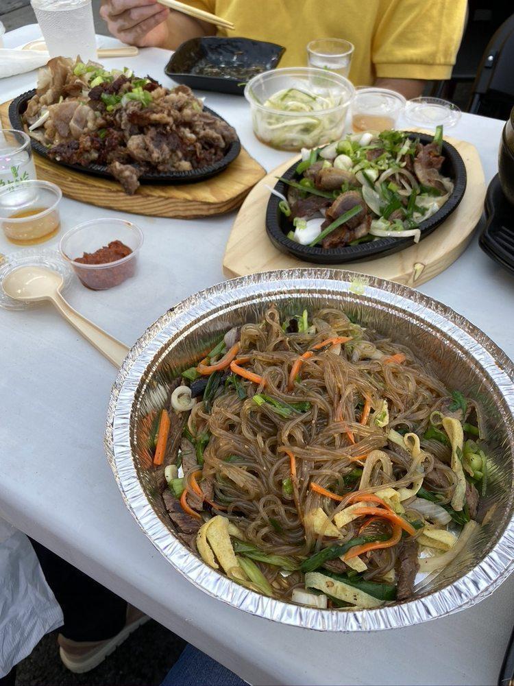 Japchae · Sauteed glass noodles with beef and vegetables.
