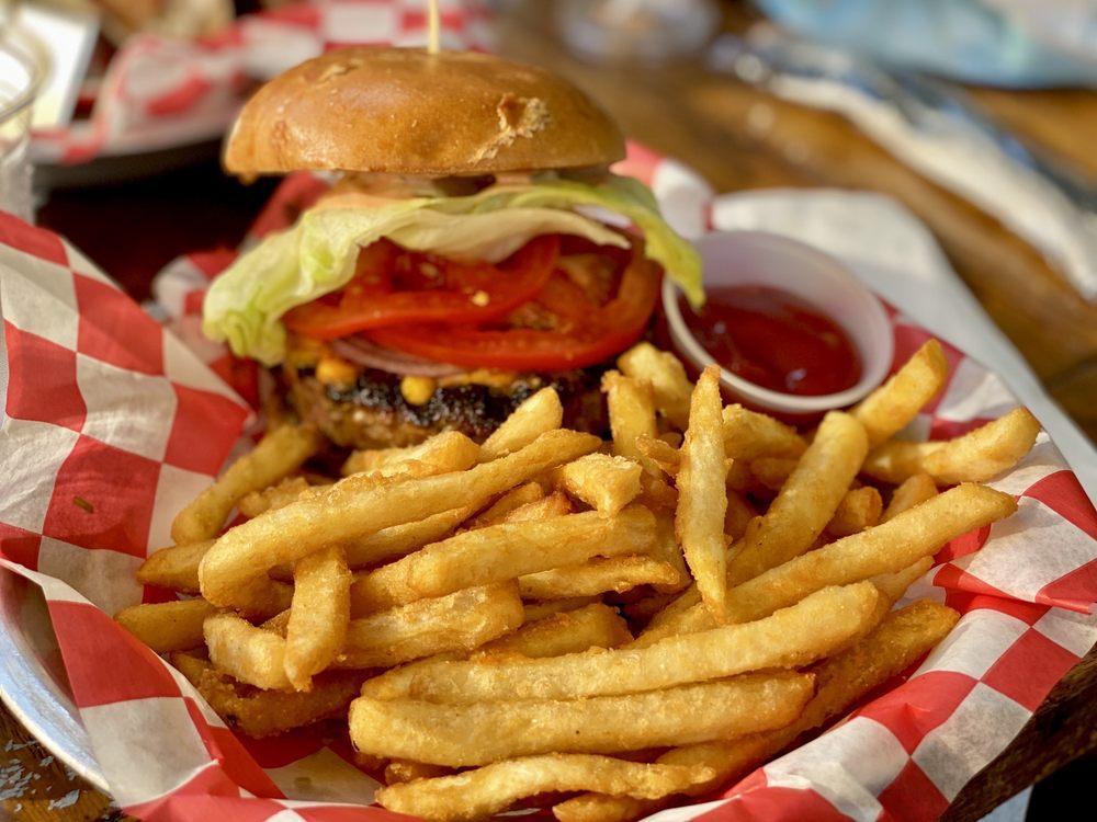 Bully Burger · beef patty, lettuce, tomato, onion, house pickles, cheddar, burger sauce, tomato jam, brioche