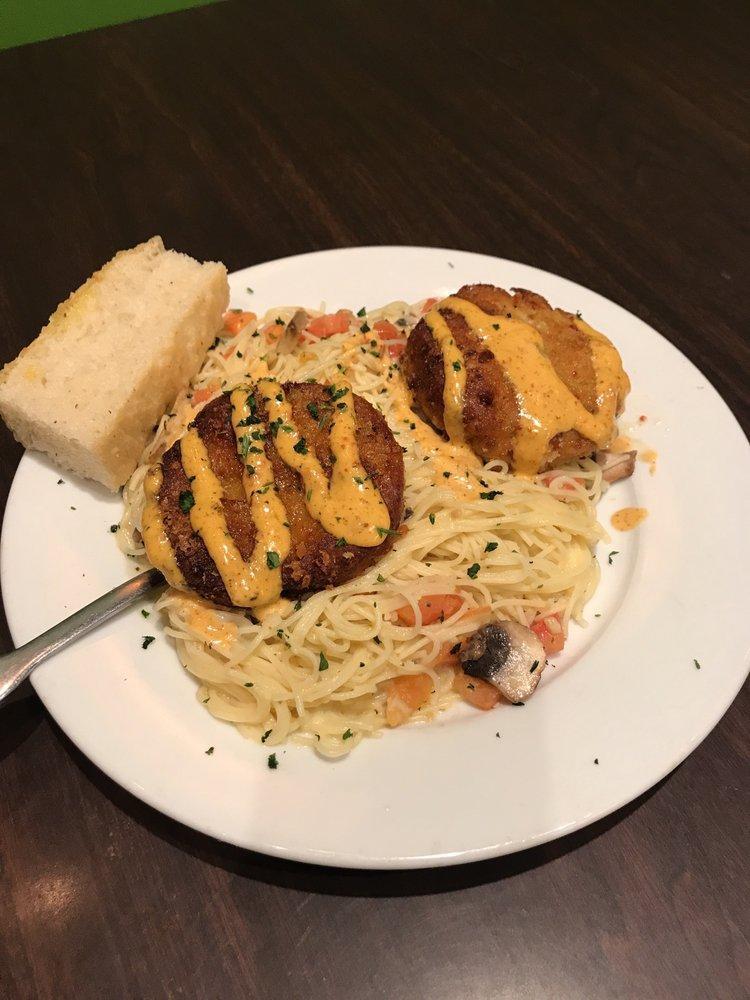 Crab Cake Italiano · Angel hair pasta tossed with lemon garlic butter, Asiago cheese, tomatoes and
mushrooms, covered with Alfredo sauce and topped with two crab cakes garnished
with chipotle aioli.