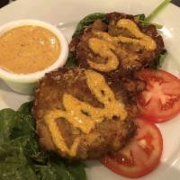 Crab Cakes · Traditional crab cakes loaded with tender crabmeat, shrimp and spices and pan-seared to perf...