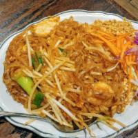 Pad Thai · Pan-fried rice noodles with shrimp, chicken, egg, crushed peanuts, bean sprouts and green on...