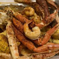 Krab Kingz Snow Crab and Shrimp · 2 snow crabs, 13 shrimp, 1 sausage, corn, egg and potatoes.