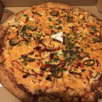 Butter Chicken Pizza · Pizza sauce, Tandoori chicken, onions, green bell peppers, makhani sauce, fresh garlic, ging...