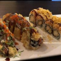 American Dream Roll · Rock shrimp tempura inside, topped with spicy lobster and spicy crab meat with spicy cream s...