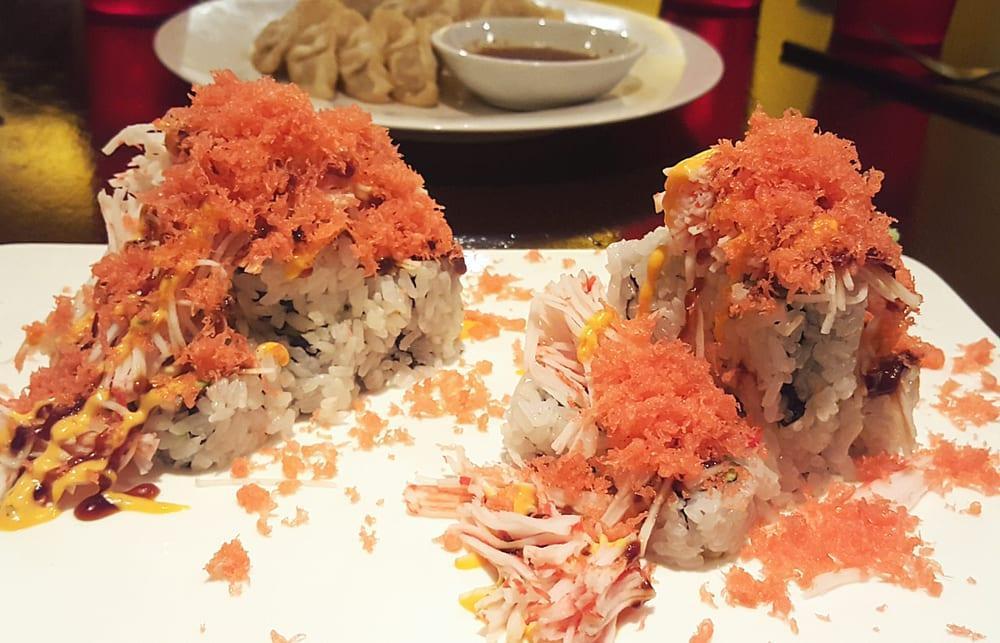 Volcano Roll · Salmon, tuna, avocado inside with spicy lobster and spicy crab on the top.