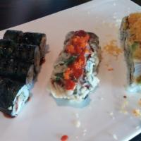 Angry Dragon Roll · Shrimp tempura inside, white fish with avocado on top.