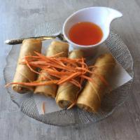 Thai Crispy Rolls · Crispy fried veggie egg rolls with silver noodles, cabbage and carrots. Served with sweet an...