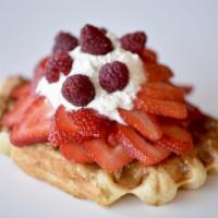 Red Wonder · Biscoff, raspberries, strawberries and house made whipped cream, on top of our golden liege ...