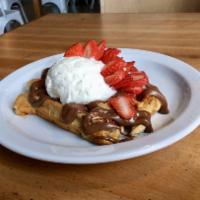 Nutella Love · Nutella, your choice of fruit and house made whipped cream, on top of our golden liege waffle.