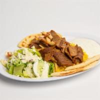 Gyro Plate · Seasoned thin sliced Lamb and beef served with tzatziki sauce, Rice, Greek salad and Pita br...