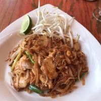 Pad Thai · Stir-fried rice noodle with egg, scallion, bean sprout and peanut. With choice of chicken, v...