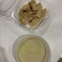 Roti · With green curry dip.