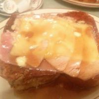 Monte Cristo · Challah bread french toast with white meat turkey, Swiss cheese, and ham, grilled to perfect...