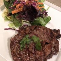 Crying Tiger · Slow grilled marinated 12 oz. rib eye steak with salad and chef’s spicy secret sauce.