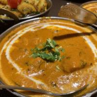 Butter Chicken · White meat in smooth, rich, creamy tomato gravy. Gluten free.

Served with Complimentary Whi...