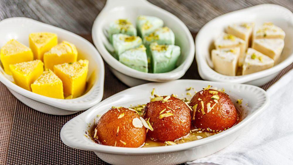 Gulab Jamun · 2pcof Fried milk rounds soaked in sugar syrup.