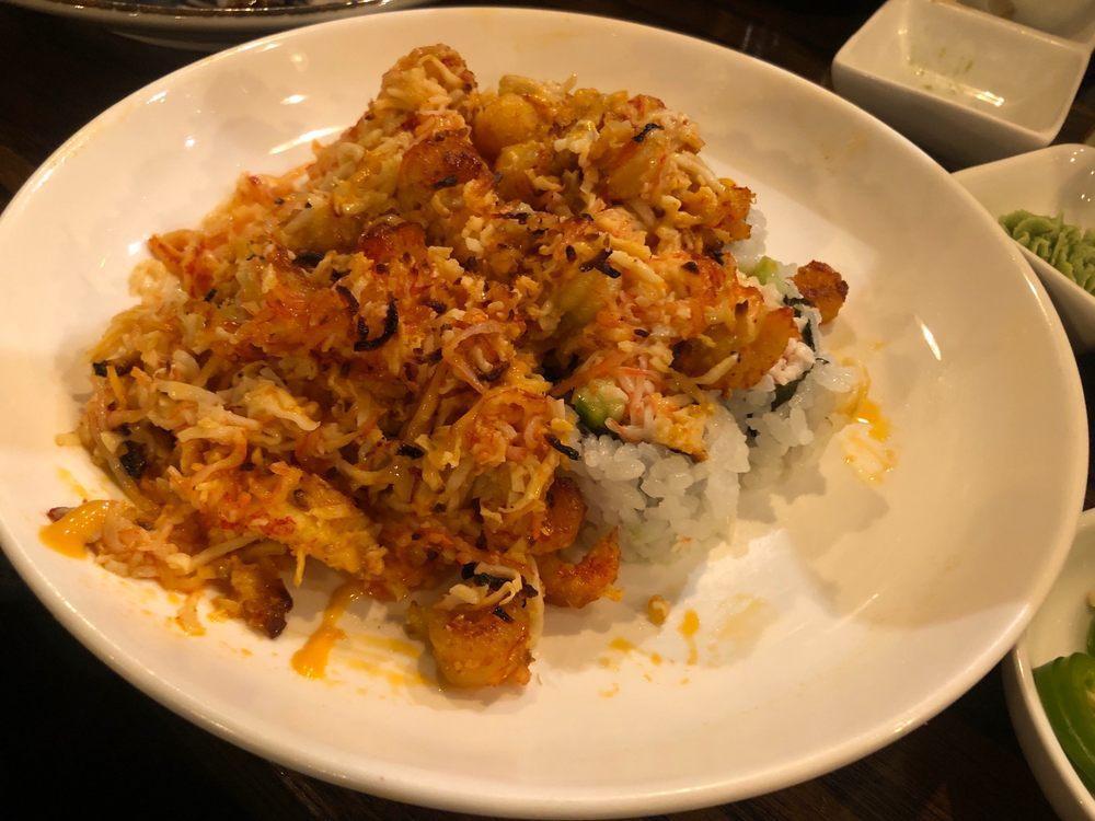Volcano Roll · California roll topped with baked marinated craw fish and crab meat with spicy mayo and eel sauce.