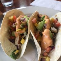 Blackened Mahi Mahi Tacos · 3 blackened mahi mahi tacos served with Asian slaw, avocado, mango salsa, and chipotle mayo.